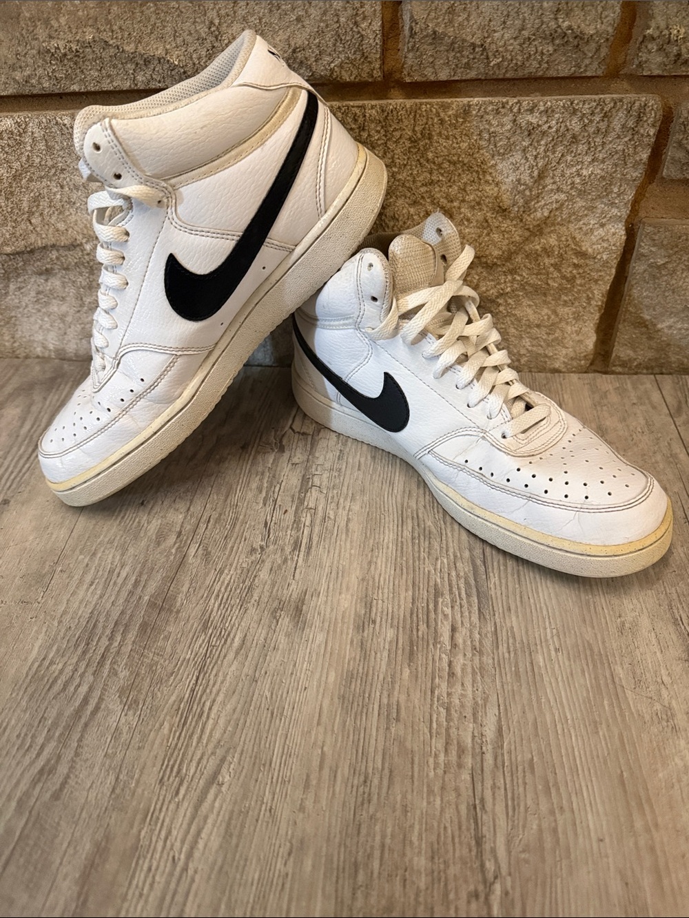 Nike White High-Top Sneakers with Black Swoosh